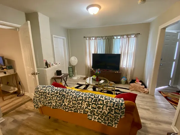 a living room with a couch and a flat screen tv