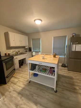 a kitchen with a stove and a microwave