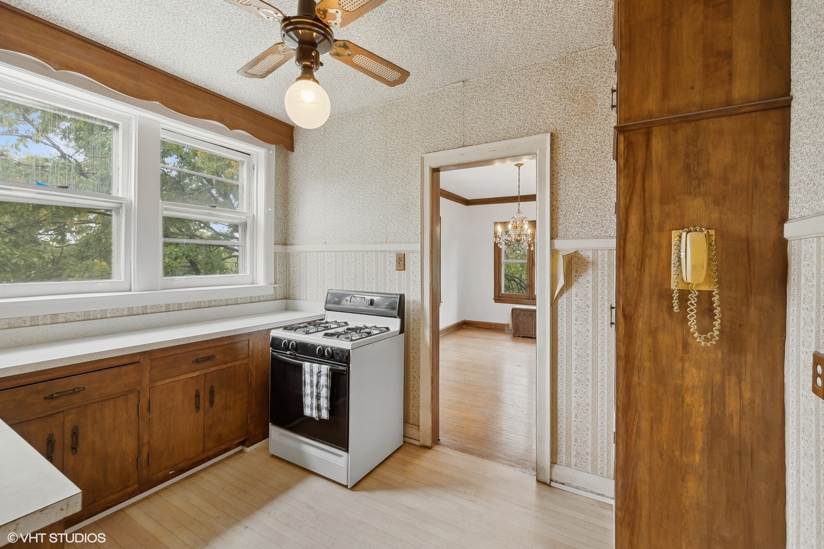 69 Longcommon Road, Unit D3 Riverside, IL 60546 - Photo 11 of 19 a kitchen with stainless steel appliances granite countertop a refrigerator a sink dishwasher a stove with white cabinets and wooden floor