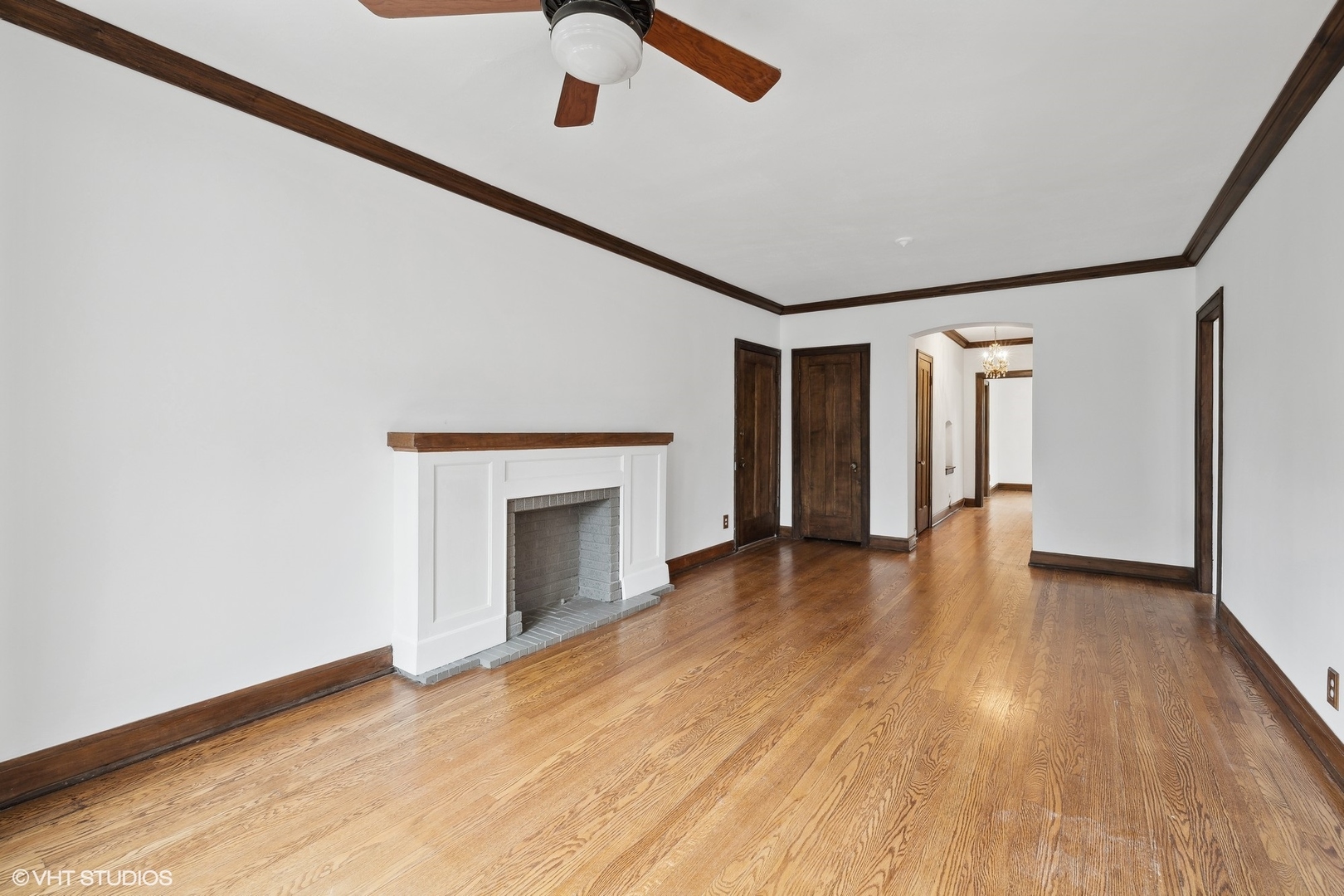 69 Longcommon Road, Unit D3 Riverside, IL 60546 - Photo 5 of 19 a view of an empty room with wooden floor and a window