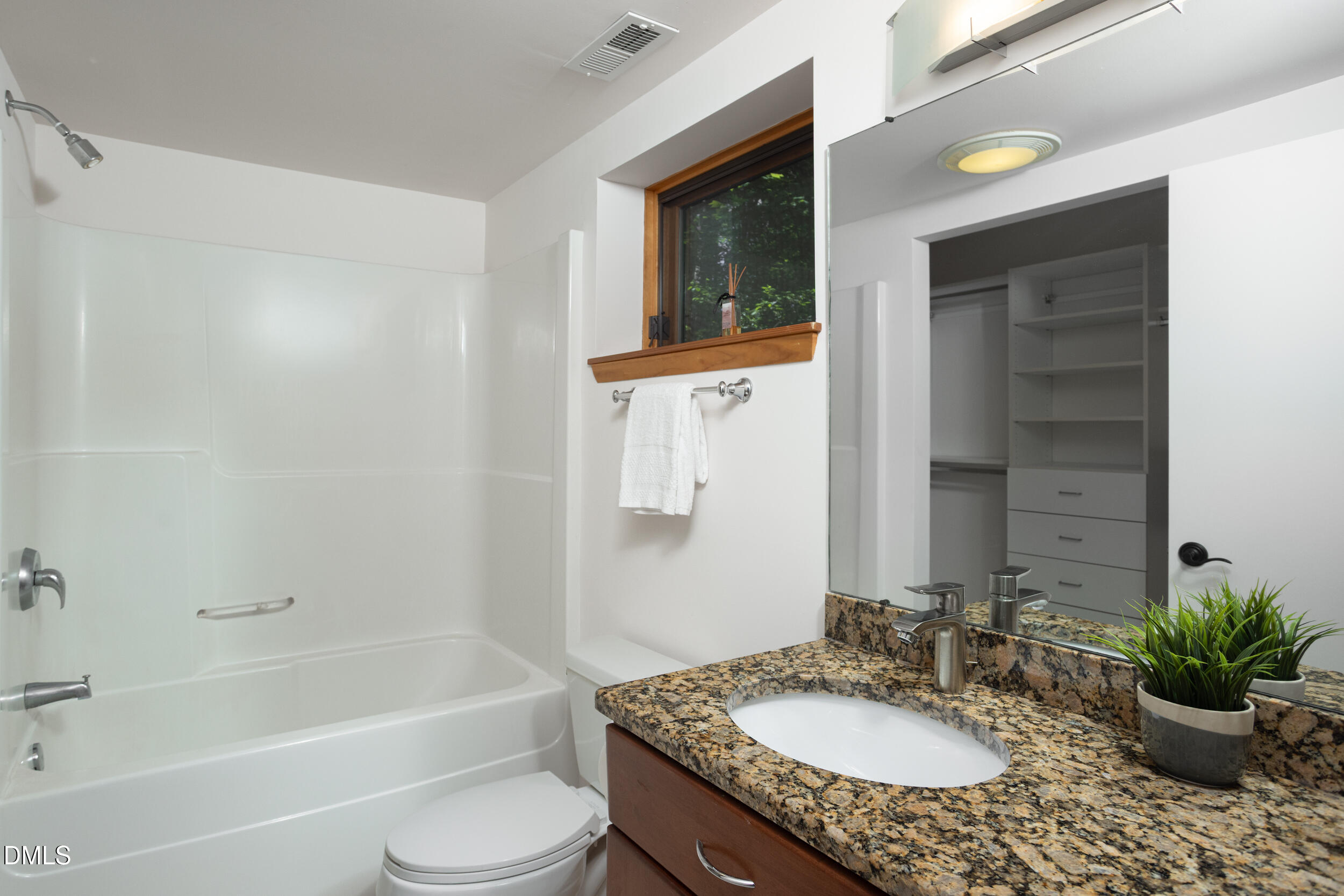 260 Bc Way Rougemont, NC 27572 - Photo 58 of 76 a bathroom with a granite countertop sink toilet a mirror and shower