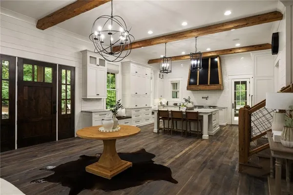 a kitchen with stainless steel appliances granite countertop a sink and stove