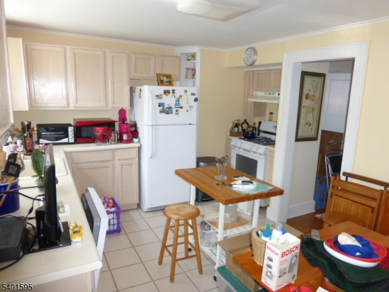 18 Sherman Avenue, Unit B Morris Plains, NJ 07950 - Photo 12 of 24 a room with furniture and wooden floor