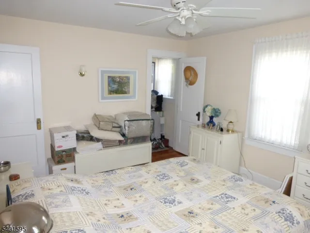 a bed room with a bed and a chandelier