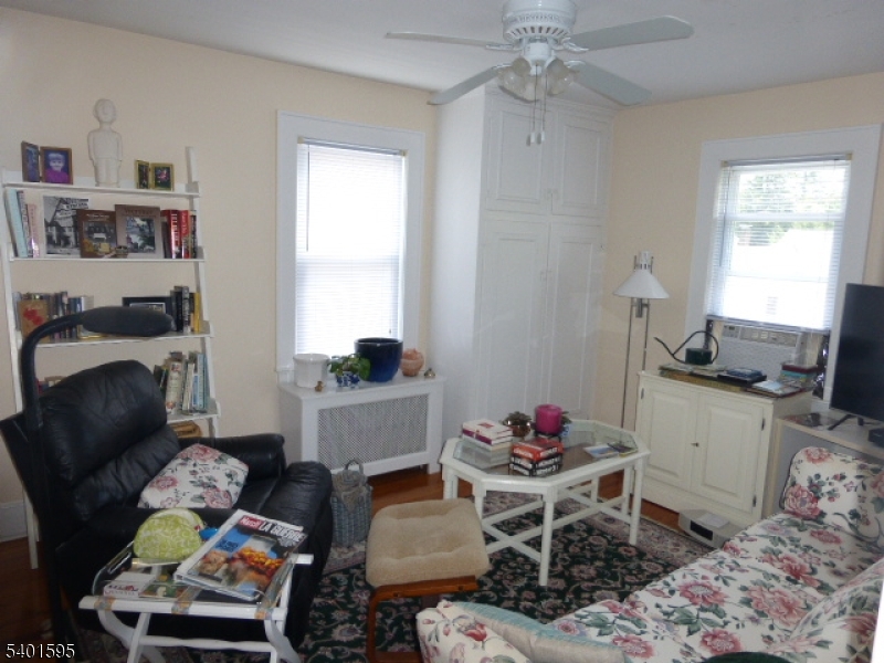 18 Sherman Avenue, Unit B Morris Plains, NJ 07950 - Photo 18 of 24 a living room with furniture and a window