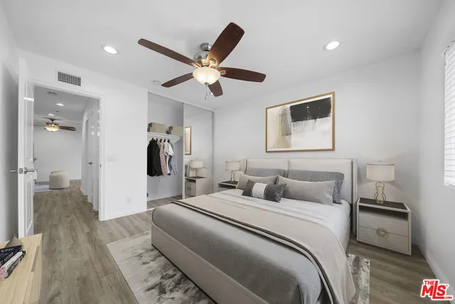 a bedroom with a bed and a walk in closet