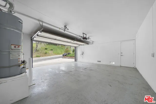 a view of hallway with furniture and a garage