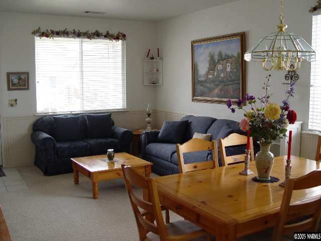 8131 Monterey Reno, NV 89506 - Photo 3 of 8 a living room with furniture and a chandelier