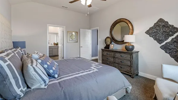 a bed room with a bed and a couch