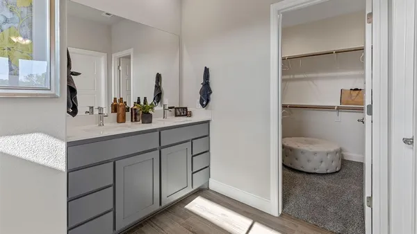 a bedroom with a bed and a mirror
