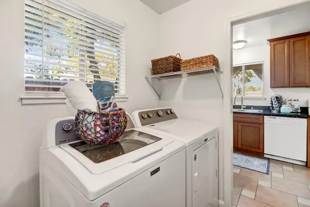 a white stove top oven sitting inside of a kitchen