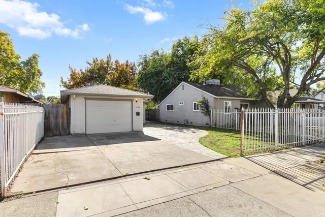 a front view of a house with a garage