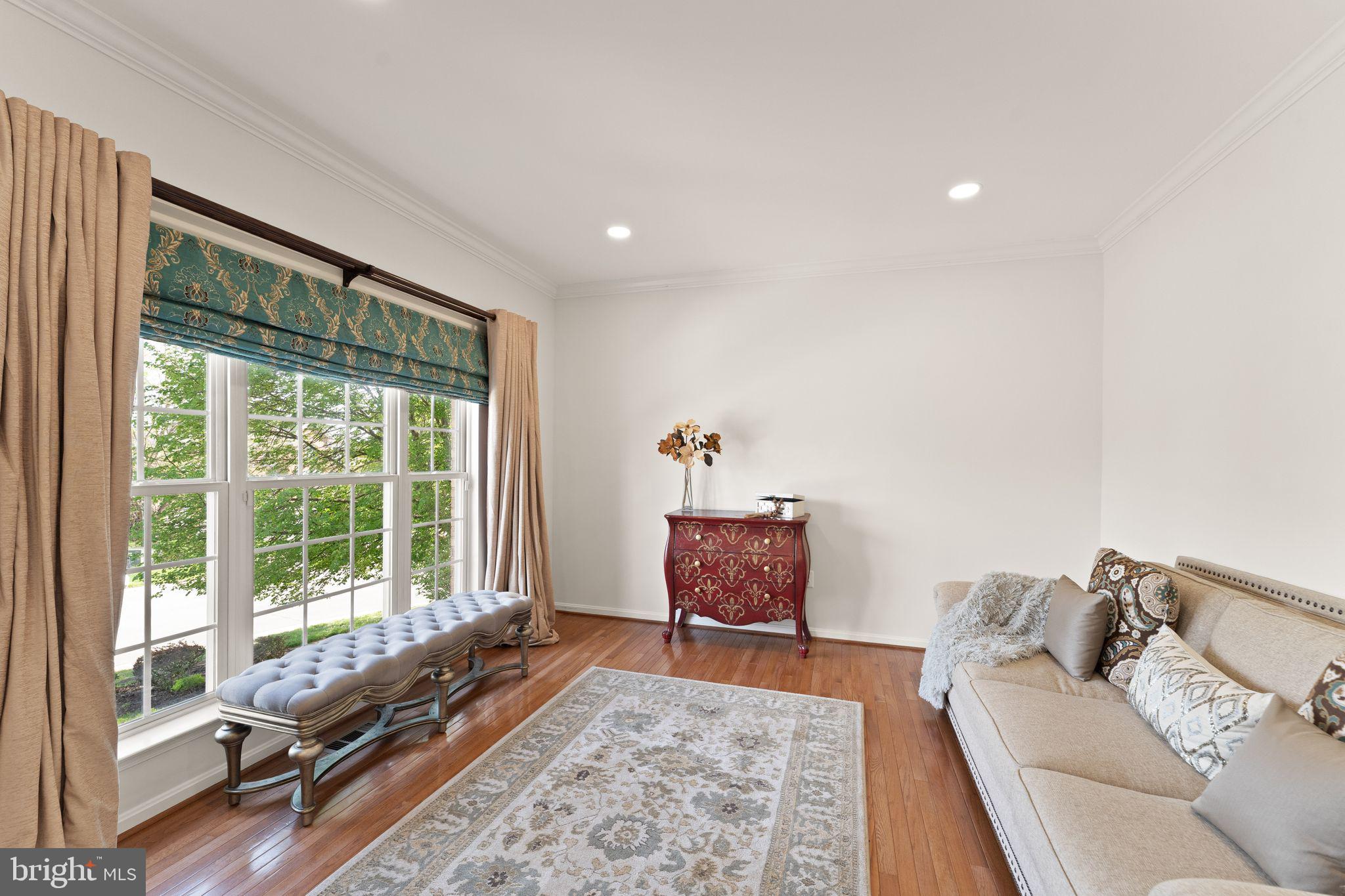 43179 Parkers Ridge Drive Leesburg, VA 20176 - Photo 14 of 108 a living room with furniture and a large window