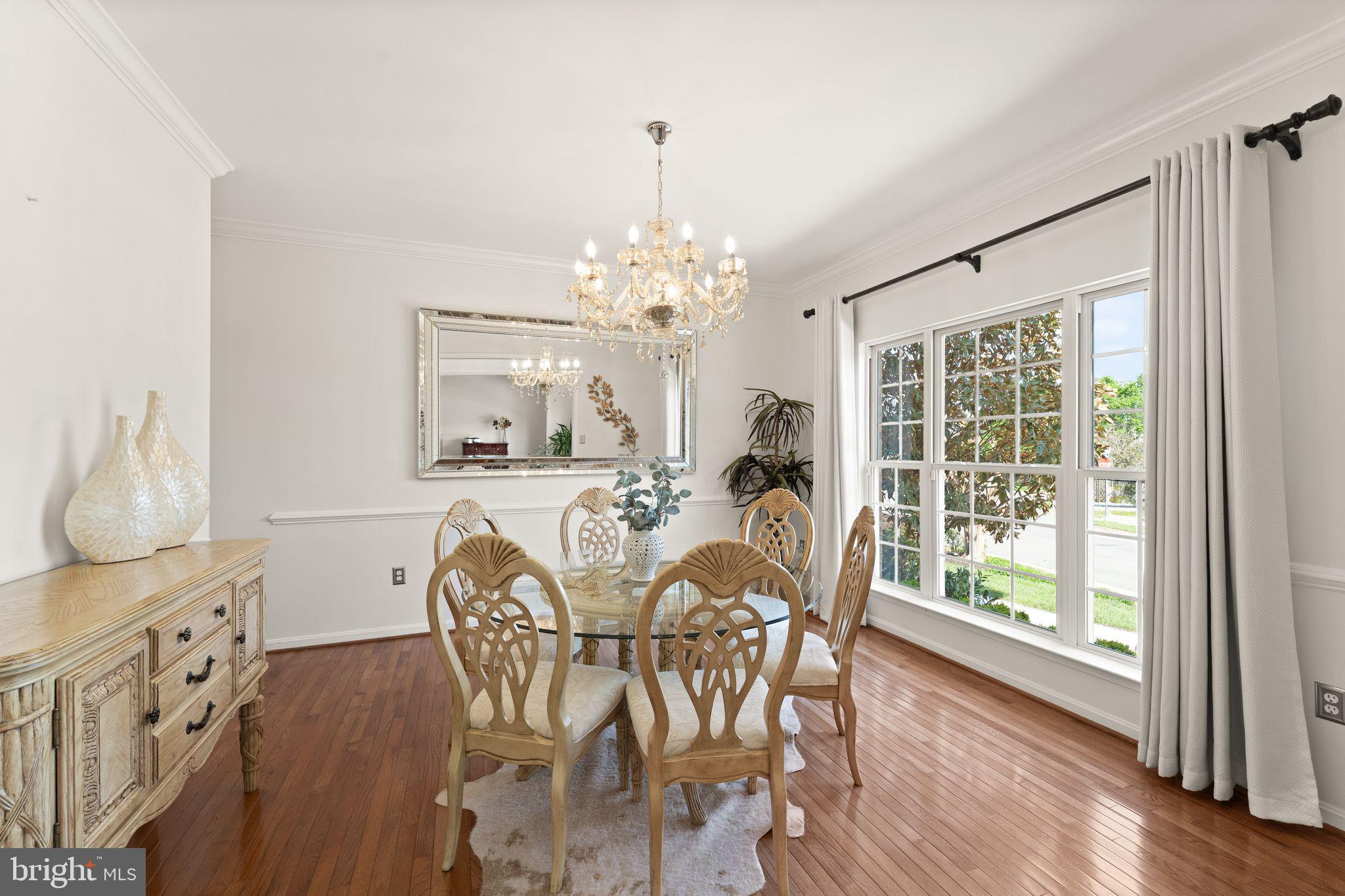 43179 Parkers Ridge Drive Leesburg, VA 20176 - Photo 16 of 108 a view of a dining room with furniture window and wooden floor