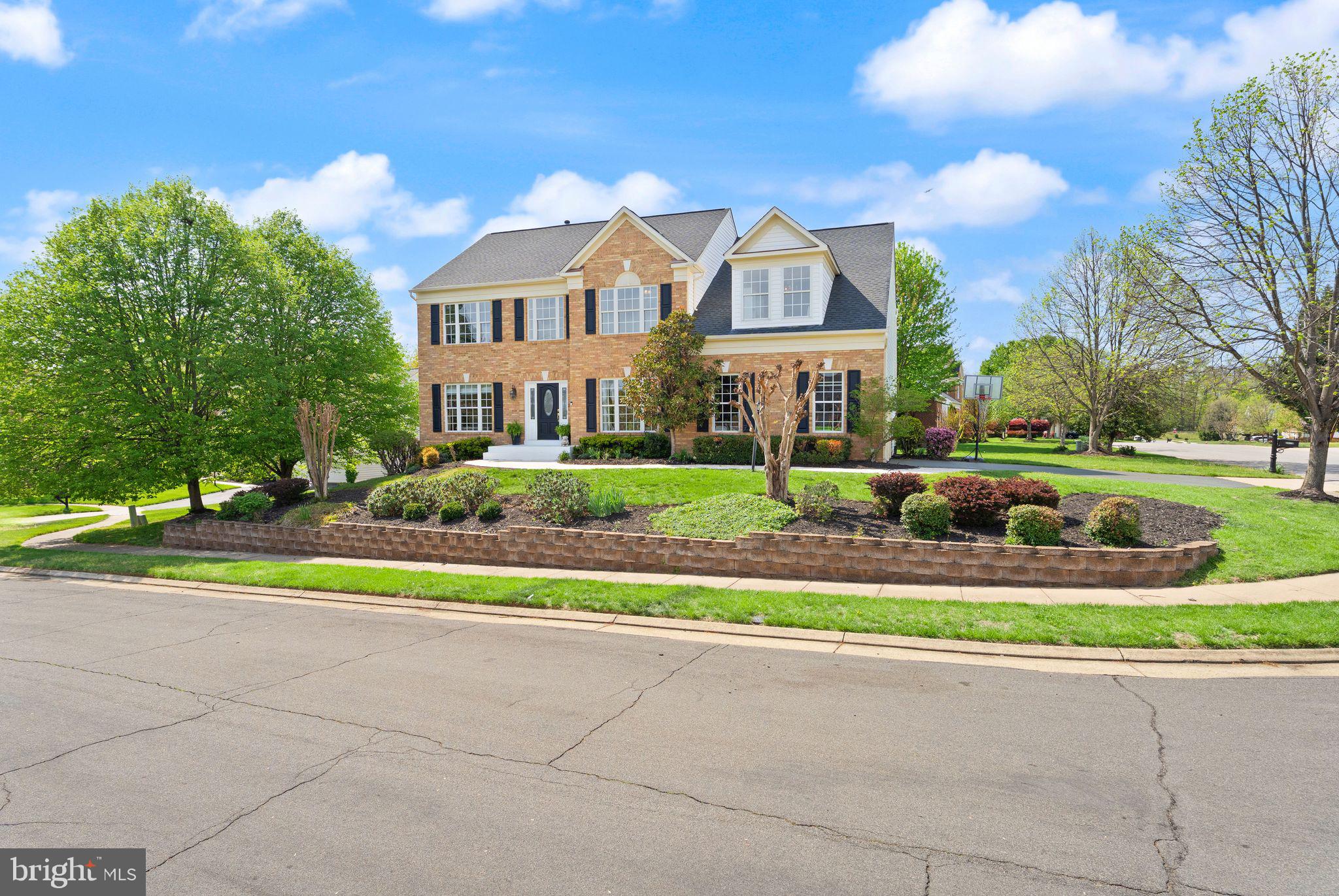 43179 Parkers Ridge Drive Leesburg, VA 20176 - Photo 3 of 108 a front view of house with yard and green space