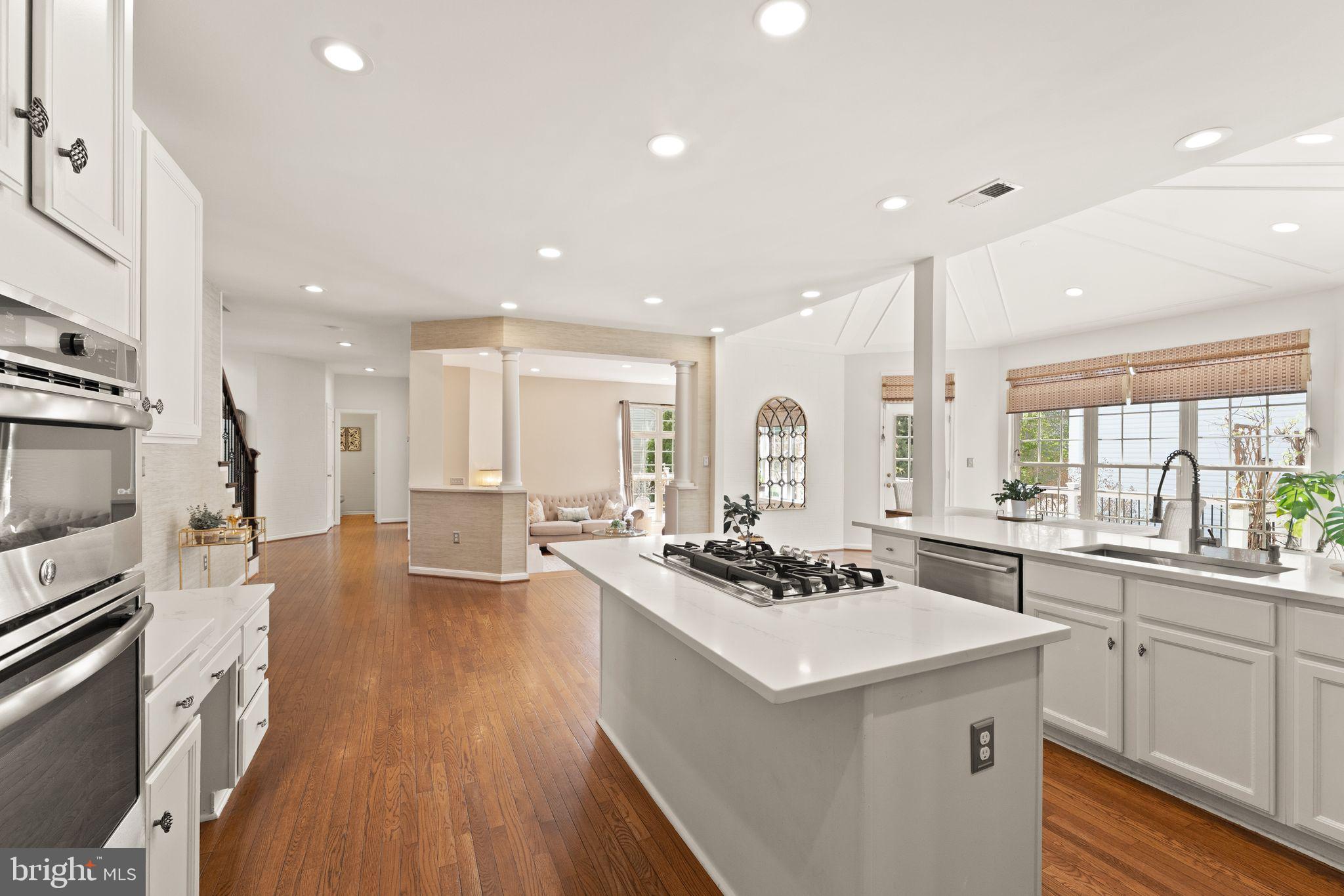 43179 Parkers Ridge Drive Leesburg, VA 20176 - Photo 38 of 108 a kitchen with a sink stove and wooden floor