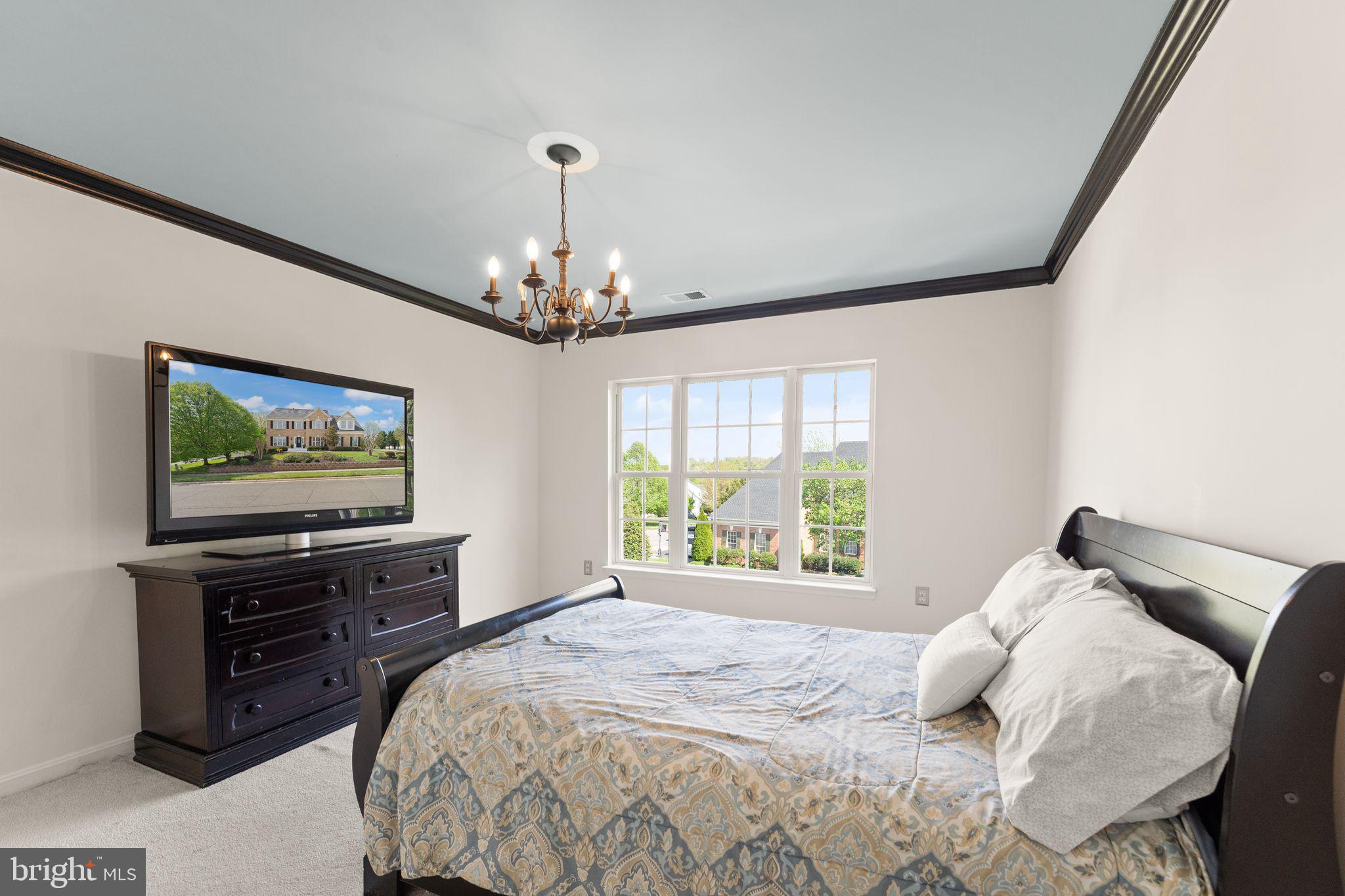 43179 Parkers Ridge Drive Leesburg, VA 20176 - Photo 59 of 108 a bedroom with a bed and a flat screen tv