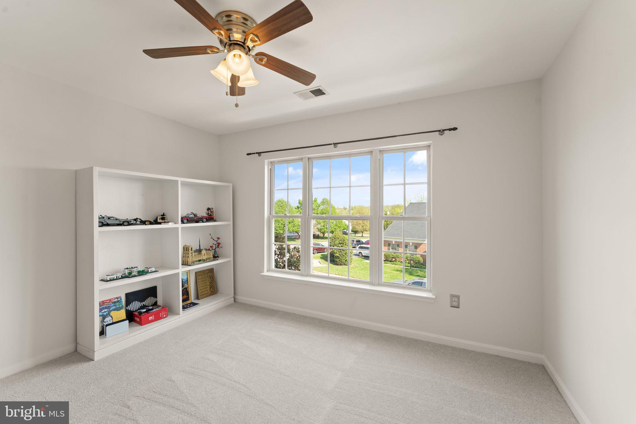 43179 Parkers Ridge Drive Leesburg, VA 20176 - Photo 62 of 108 a view of an empty room with a window and a kitchen