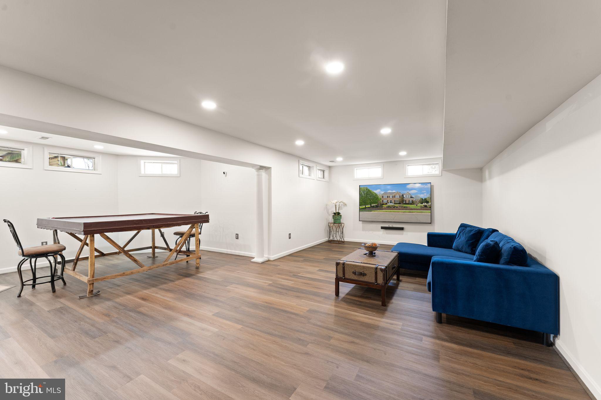 43179 Parkers Ridge Drive Leesburg, VA 20176 - Photo 71 of 108 a living room with furniture and a wooden floor