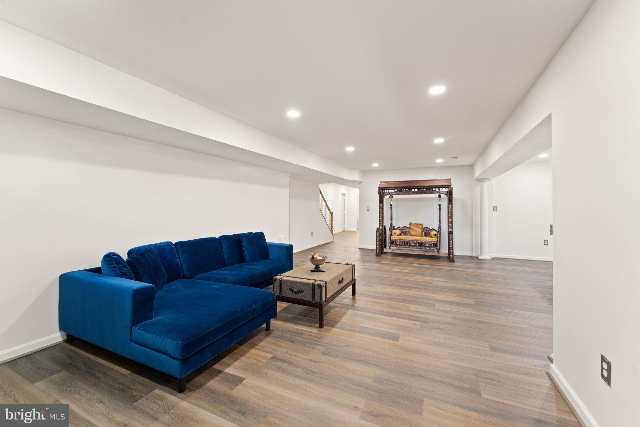 43179 Parkers Ridge Drive Leesburg, VA 20176 - Photo 73 of 108 a living room with furniture and wooden floor