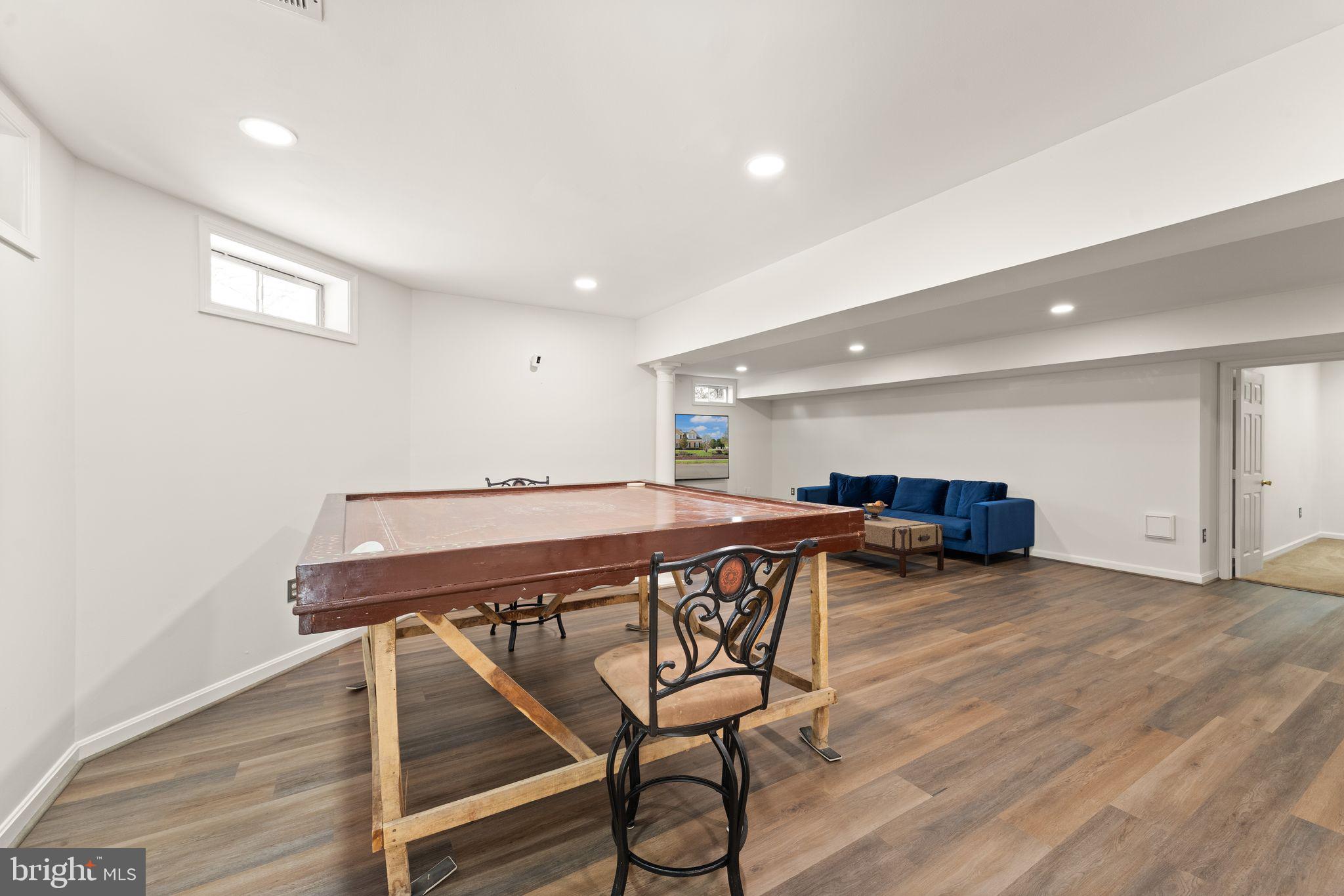 43179 Parkers Ridge Drive Leesburg, VA 20176 - Photo 75 of 108 a view of a room with furniture and wooden floor