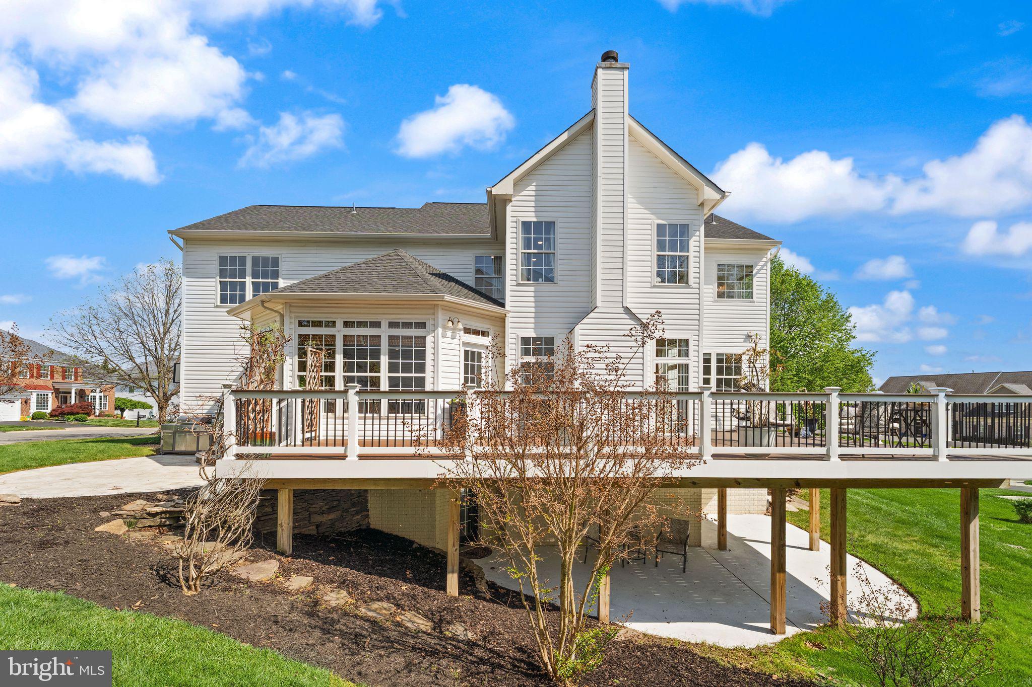 43179 Parkers Ridge Drive Leesburg, VA 20176 - Photo 91 of 108 a front view of a house with a yard table and chairs