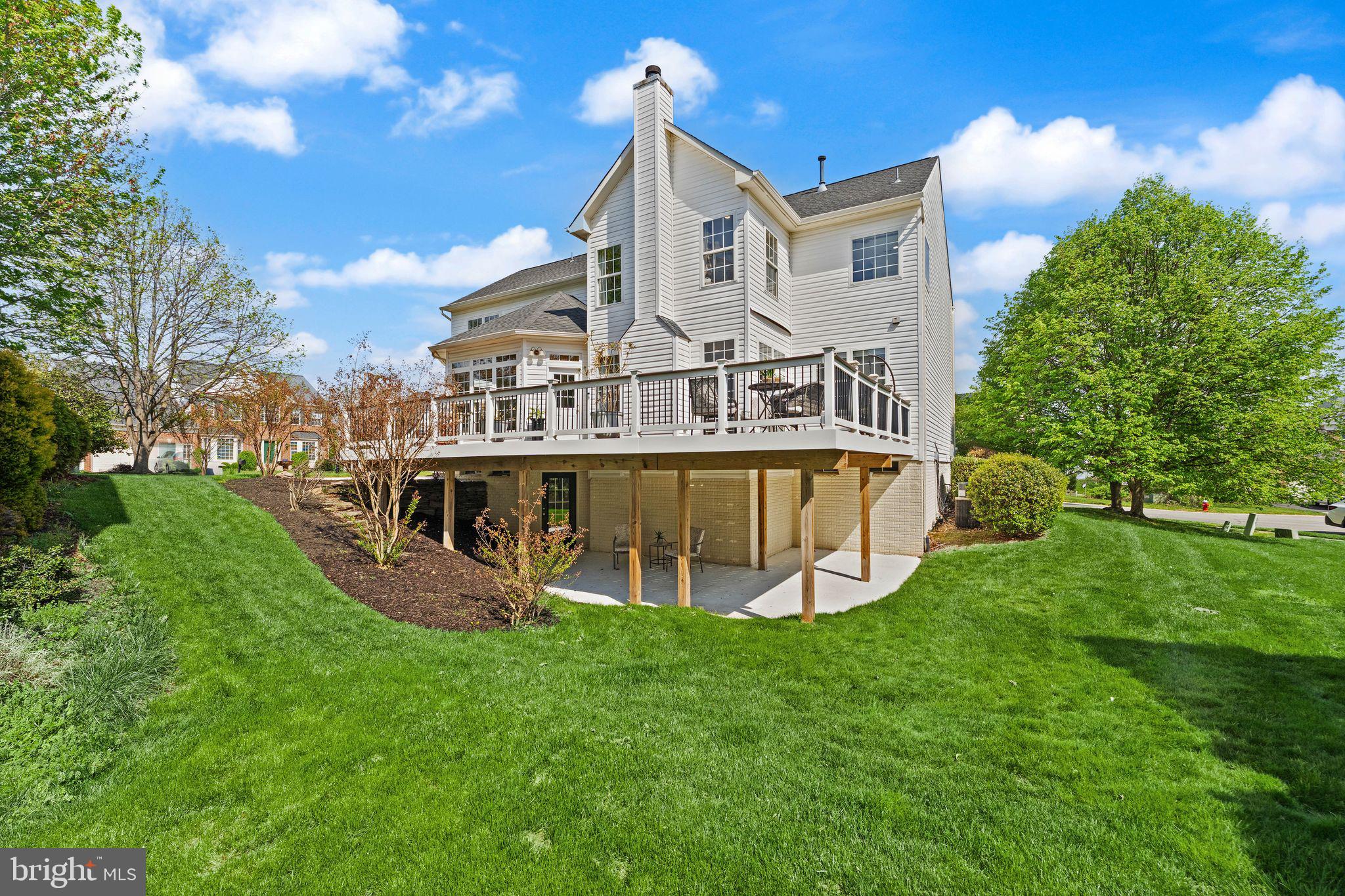 43179 Parkers Ridge Drive Leesburg, VA 20176 - Photo 93 of 108 a view of a house with a big yard and large trees