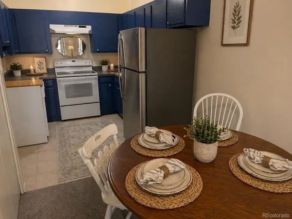 a kitchen with a table and chairs