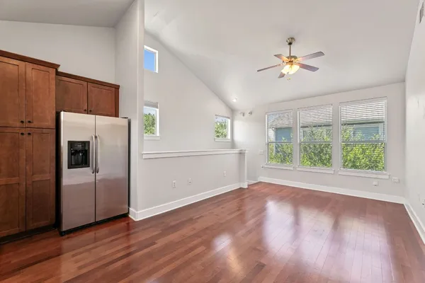 a view of a kitchen with a dishwasher cabinets and wooden floor