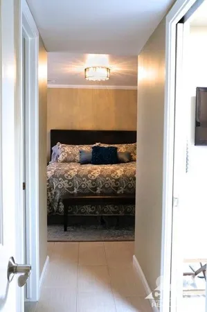 a bedroom with a bed and a mirror