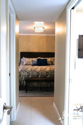 a bedroom with a bed and a mirror