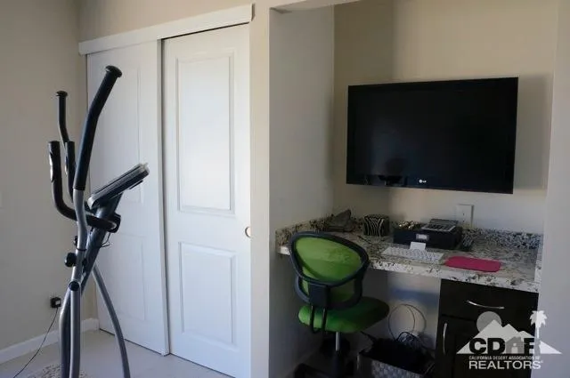 a room with lots of books and a dining table
