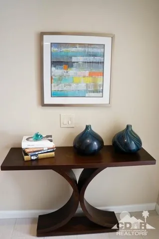 a table with chairs and a lamp