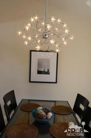 a table with wine bottles and glasses on it