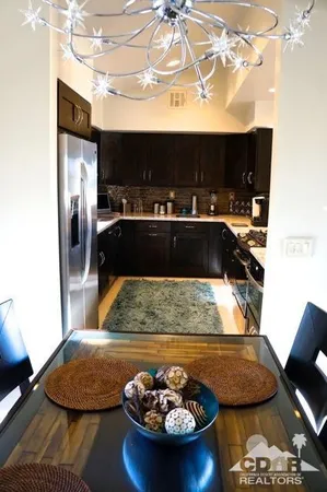 a kitchen with a sink and a stove