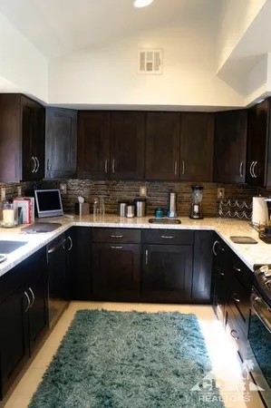 a kitchen with a sink and cabinets