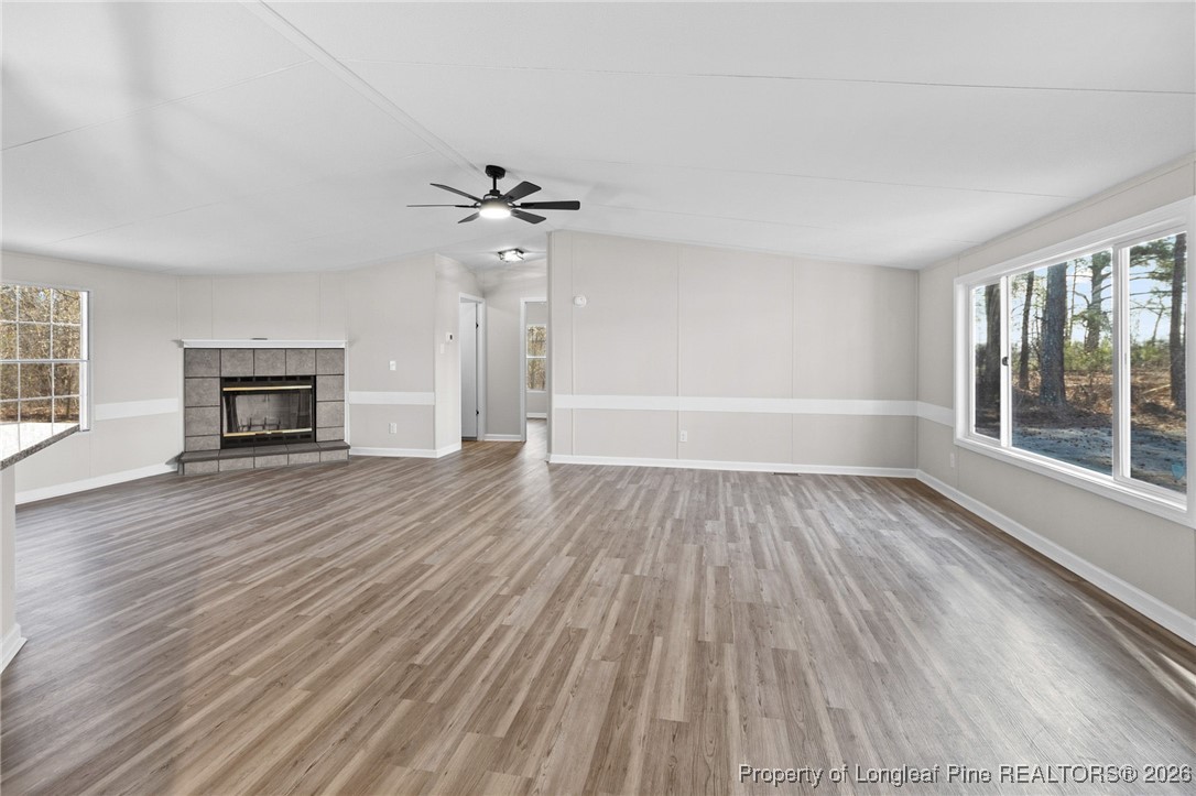 1750 John Russell Road Raeford, NC 28376 - Photo 11 of 39 wooden floor in an empty room with a window