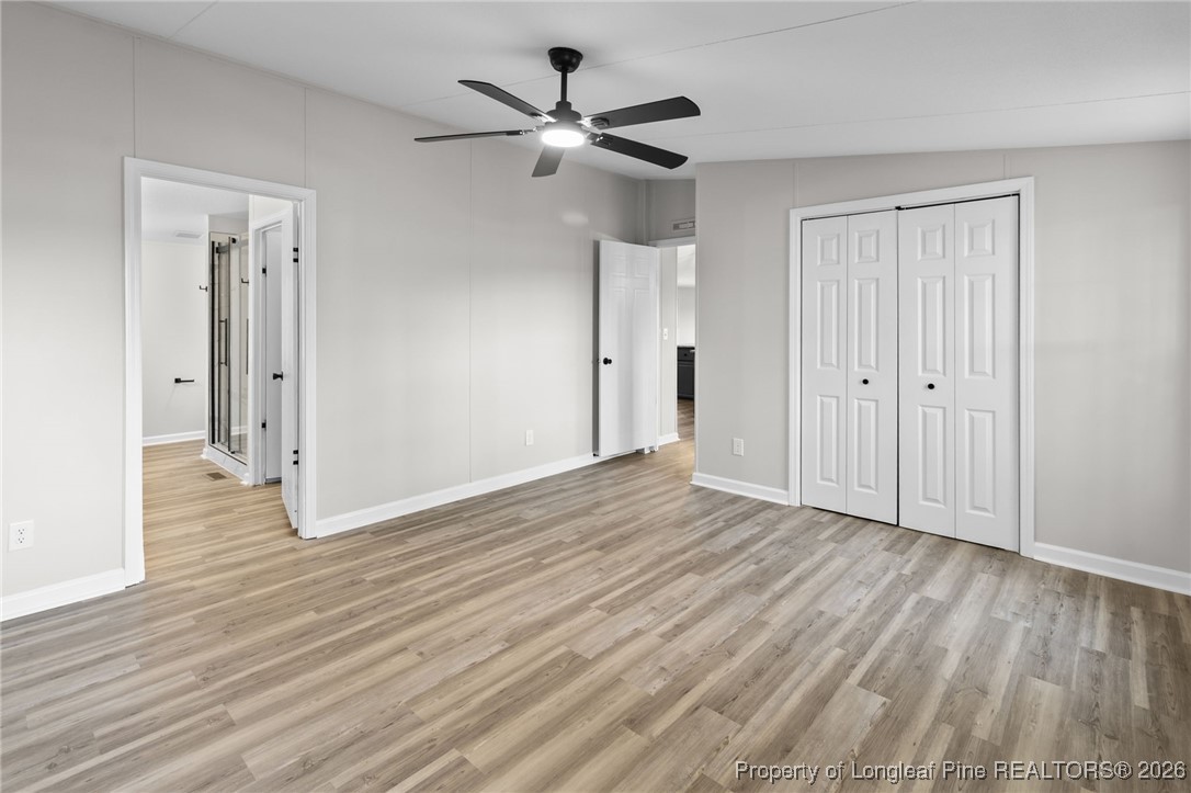 1750 John Russell Road Raeford, NC 28376 - Photo 20 of 39 a view of an empty room with wooden floor