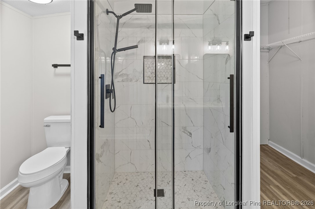 1750 John Russell Road Raeford, NC 28376 - Photo 23 of 39 a bathroom with a toilet and a shower