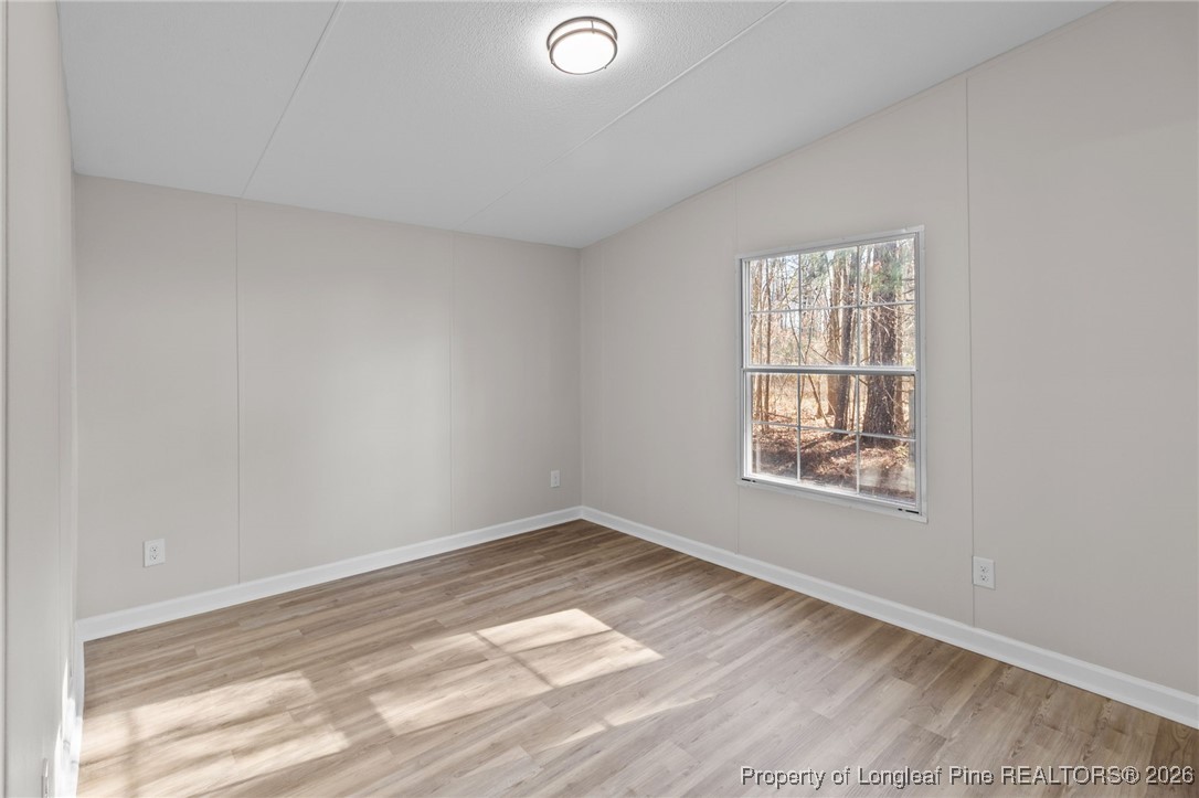 1750 John Russell Road Raeford, NC 28376 - Photo 26 of 39 an empty room with a window