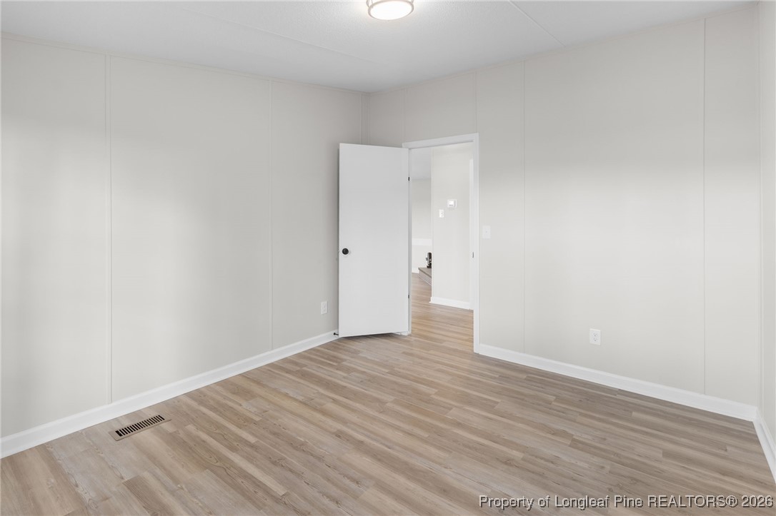 1750 John Russell Road Raeford, NC 28376 - Photo 31 of 39 a view of an empty room with wooden floor