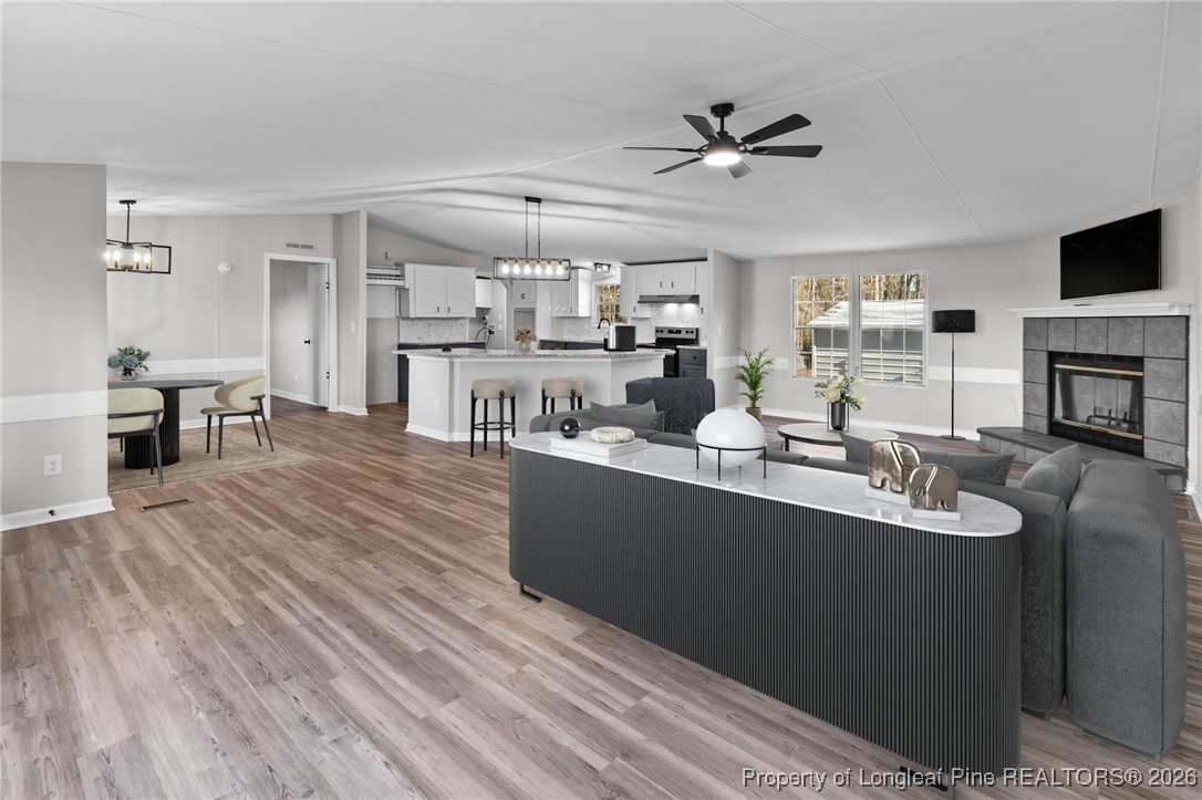 1750 John Russell Road Raeford, NC 28376 - Photo 6 of 39 a living room with furniture and a fireplace