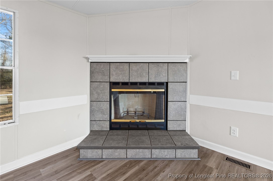 1750 John Russell Road Raeford, NC 28376 - Photo 8 of 39 a living room with a fireplace