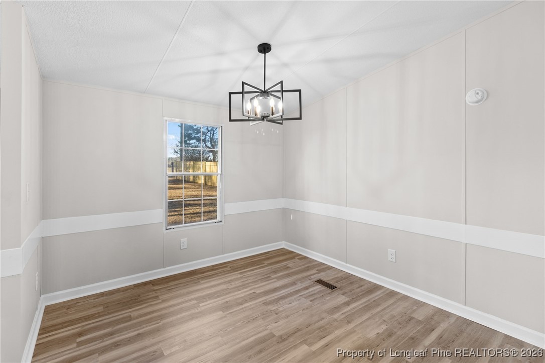 1750 John Russell Road Raeford, NC 28376 - Photo 9 of 39 a view of a room with wooden floor cabinets and a window
