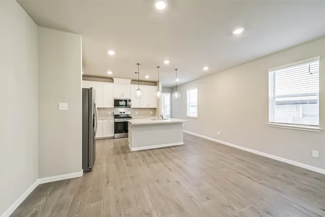 a view of kitchen with wooden floor