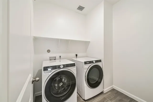 a utility room with dryer and washer