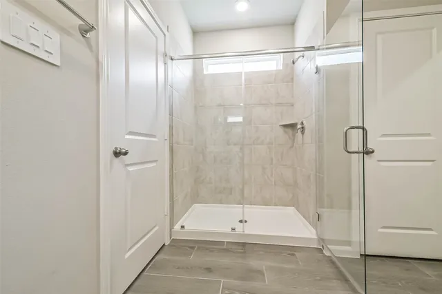 a bathroom with a tub and a shower
