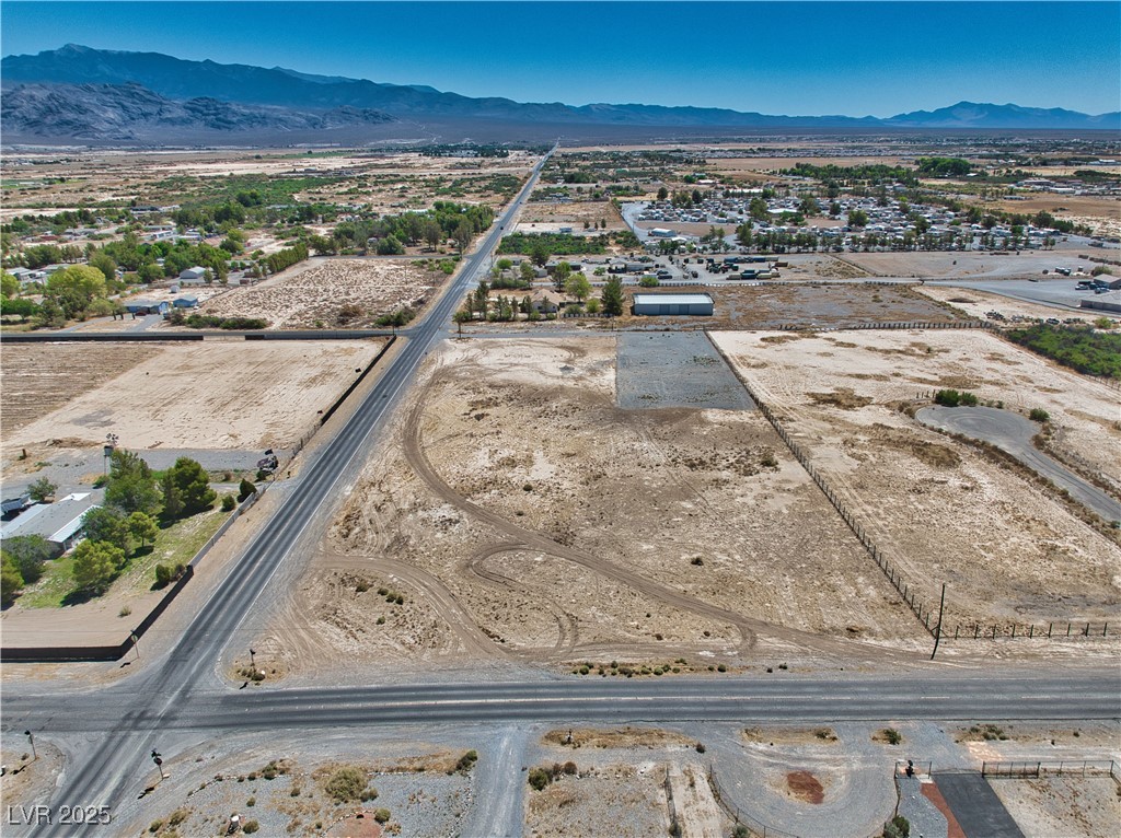 2161 East Manse Road Pahrump, NV 89048 - Photo 16 of 18 View of rural area featuring a desert landscape and a mountainous background