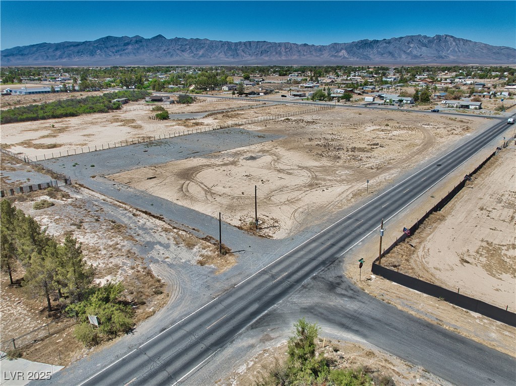 2161 East Manse Road Pahrump, NV 89048 - Photo 10 of 18 Aerial view of sparsely populated area featuring a mountain backdrop