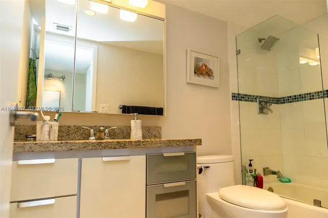 a bedroom with two beds and window